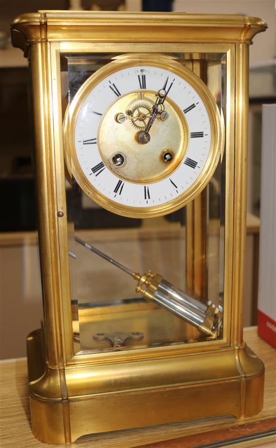 A French gilt brass four glass mantel clock, with white enamelled Roman chapter ring, H 14in